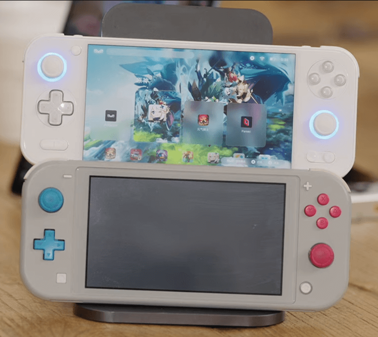 The Pocket S being held next to the Switch Lite.