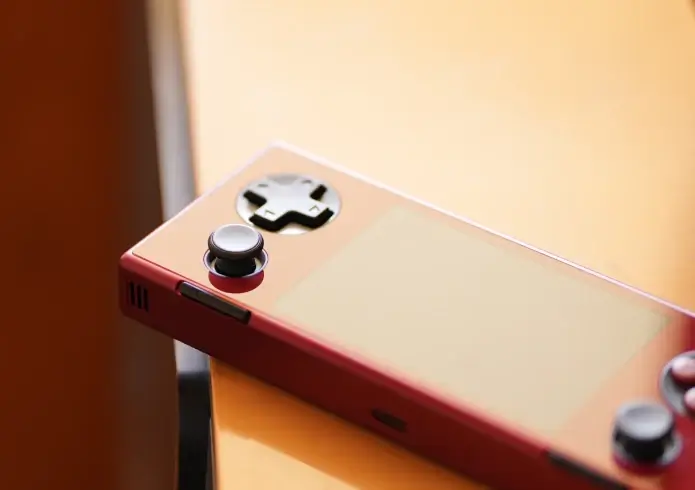 Soul Red Pocket Micro laying on a wooden table